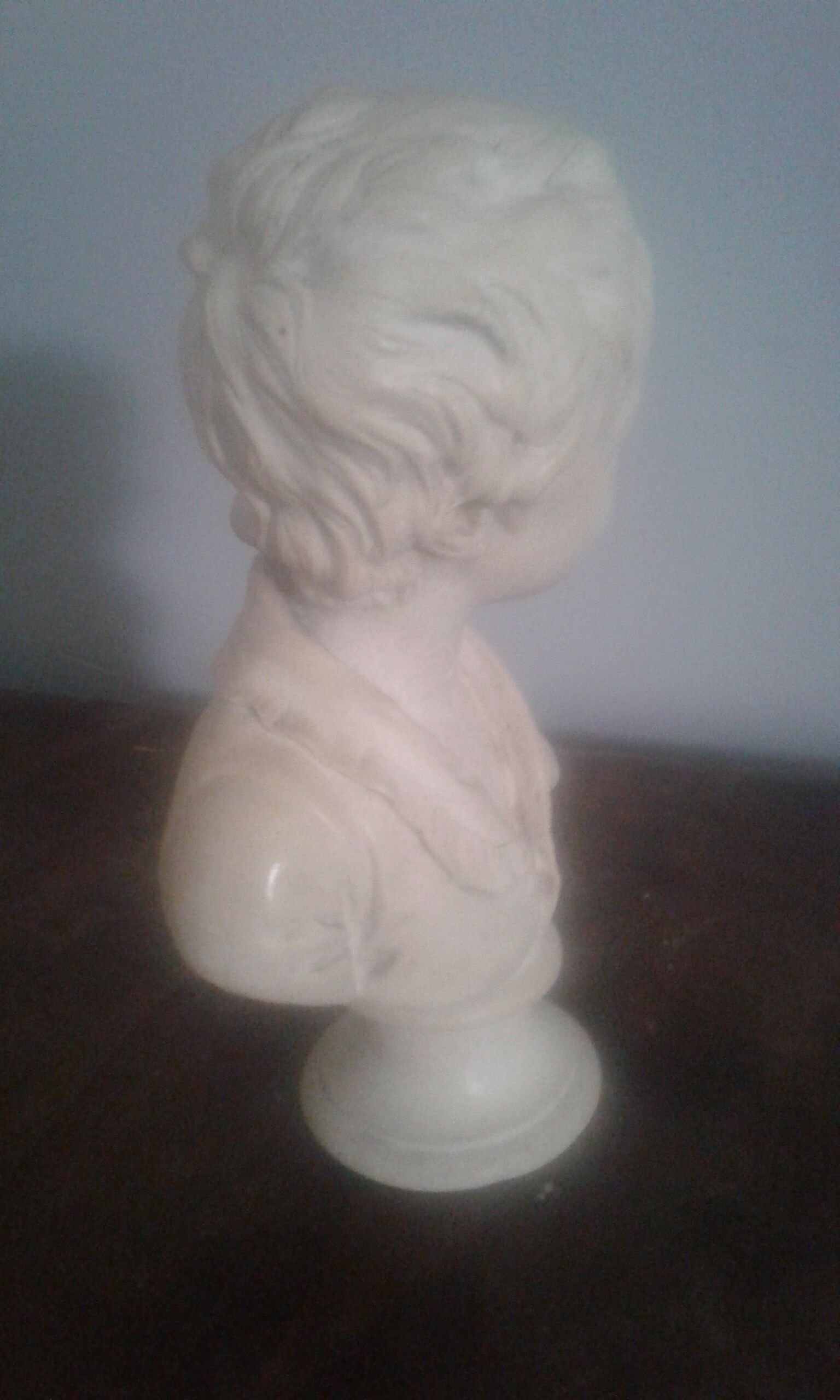 Boy bust in plaster