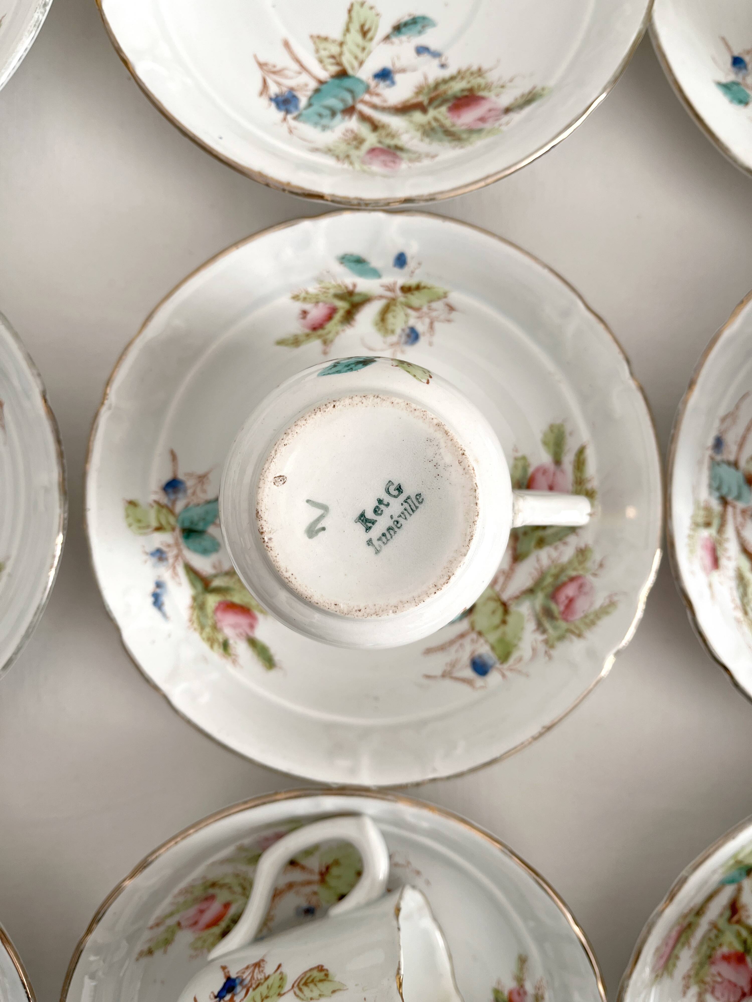 12 ironstone coffee cups with polychrome floral decoration, KG Lunéville