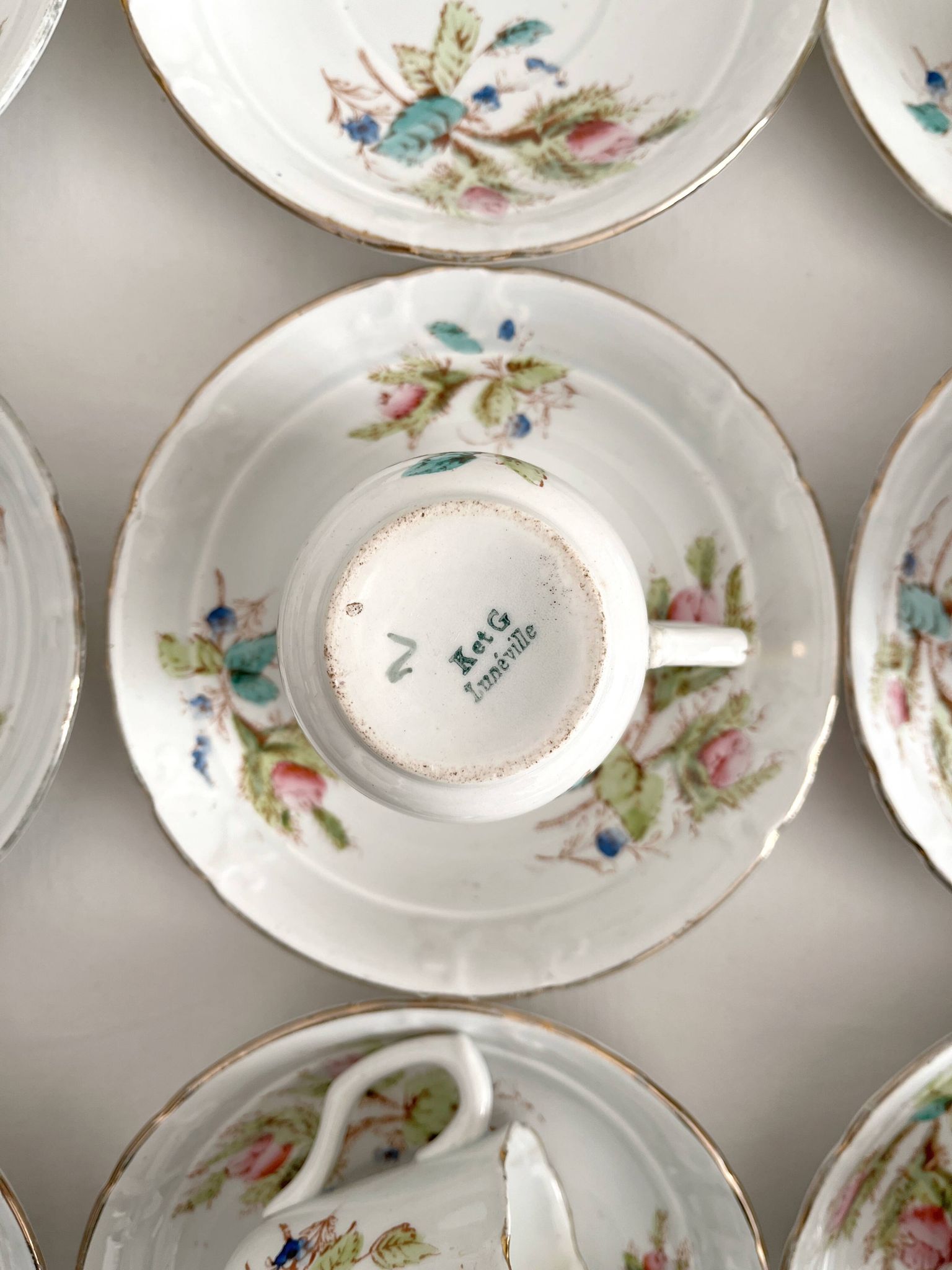 12 ironstone coffee cups with polychrome floral decoration, KG Lunéville