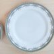 Ensemble de 8 assiettes à dessert et un plat Limoges