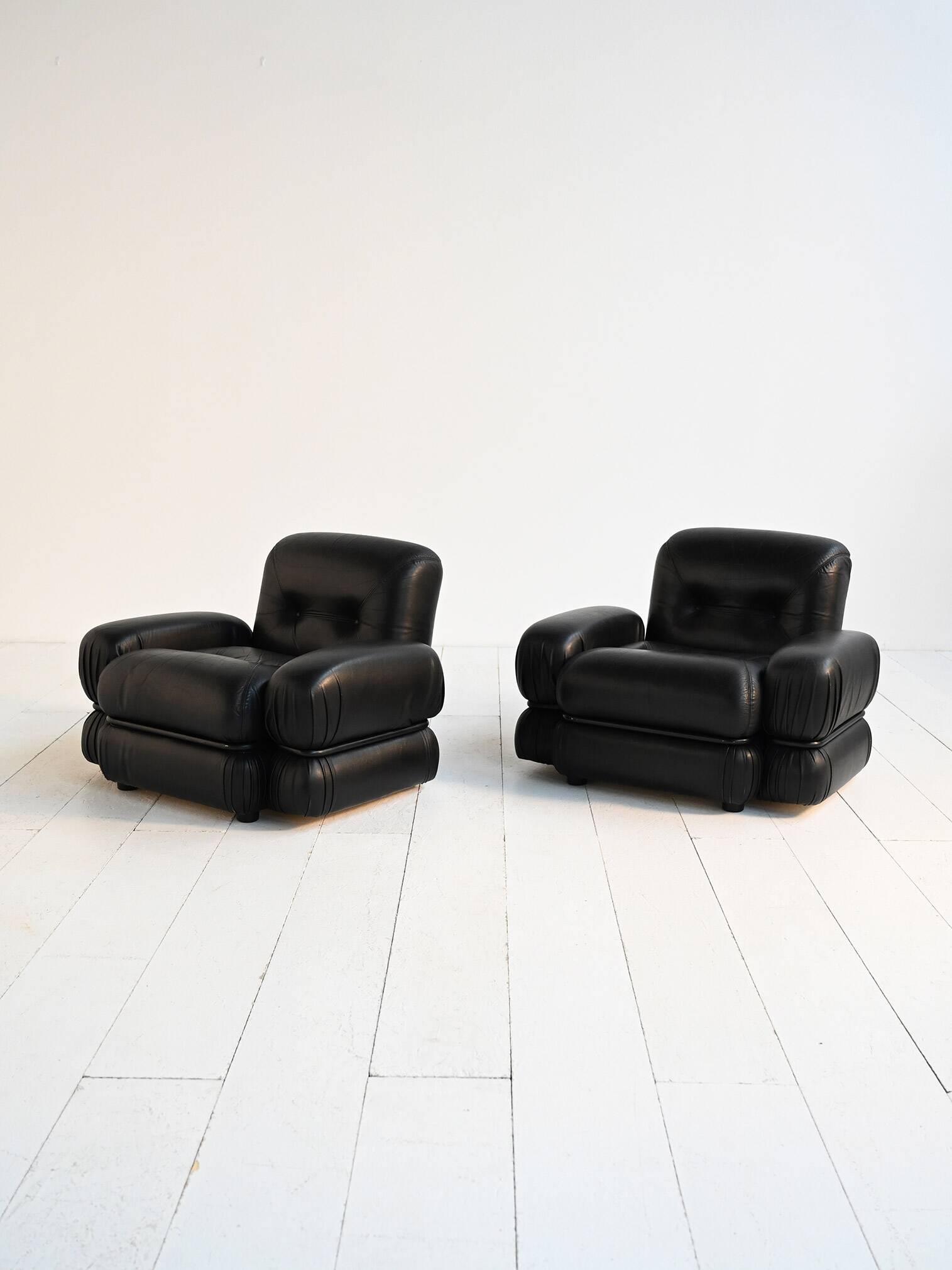 Black leather and tubular steel armchairs, 1970s