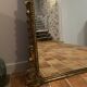 Large gilded mirror with pediment