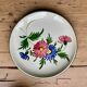 Large cup and saucer in the quimper earthenware style.