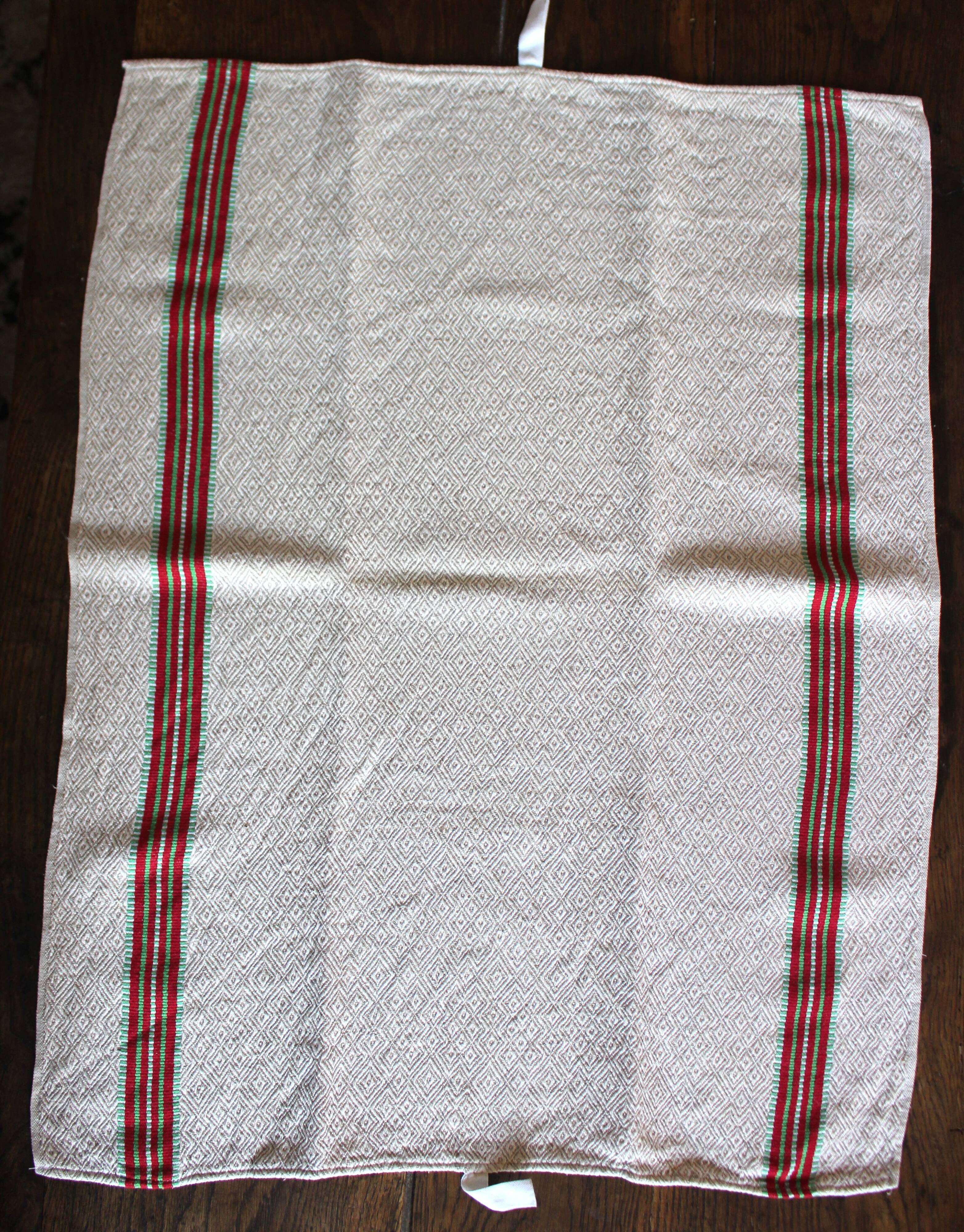 Old chevron towel with red and green stripes.