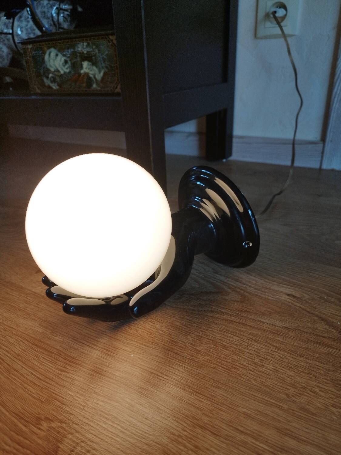 Hand-shaped wall light