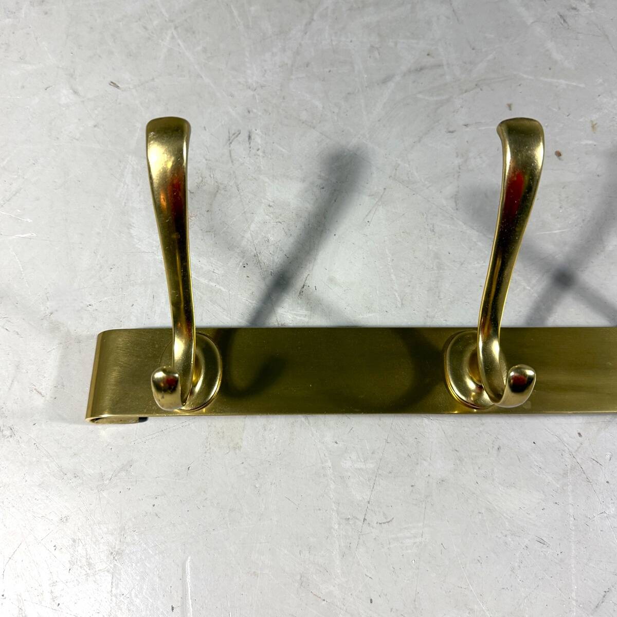 Gold coloured aluminium wall coat rack 1960’s