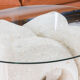 A Vintage White Stone Coffee Table with Glass Table Top