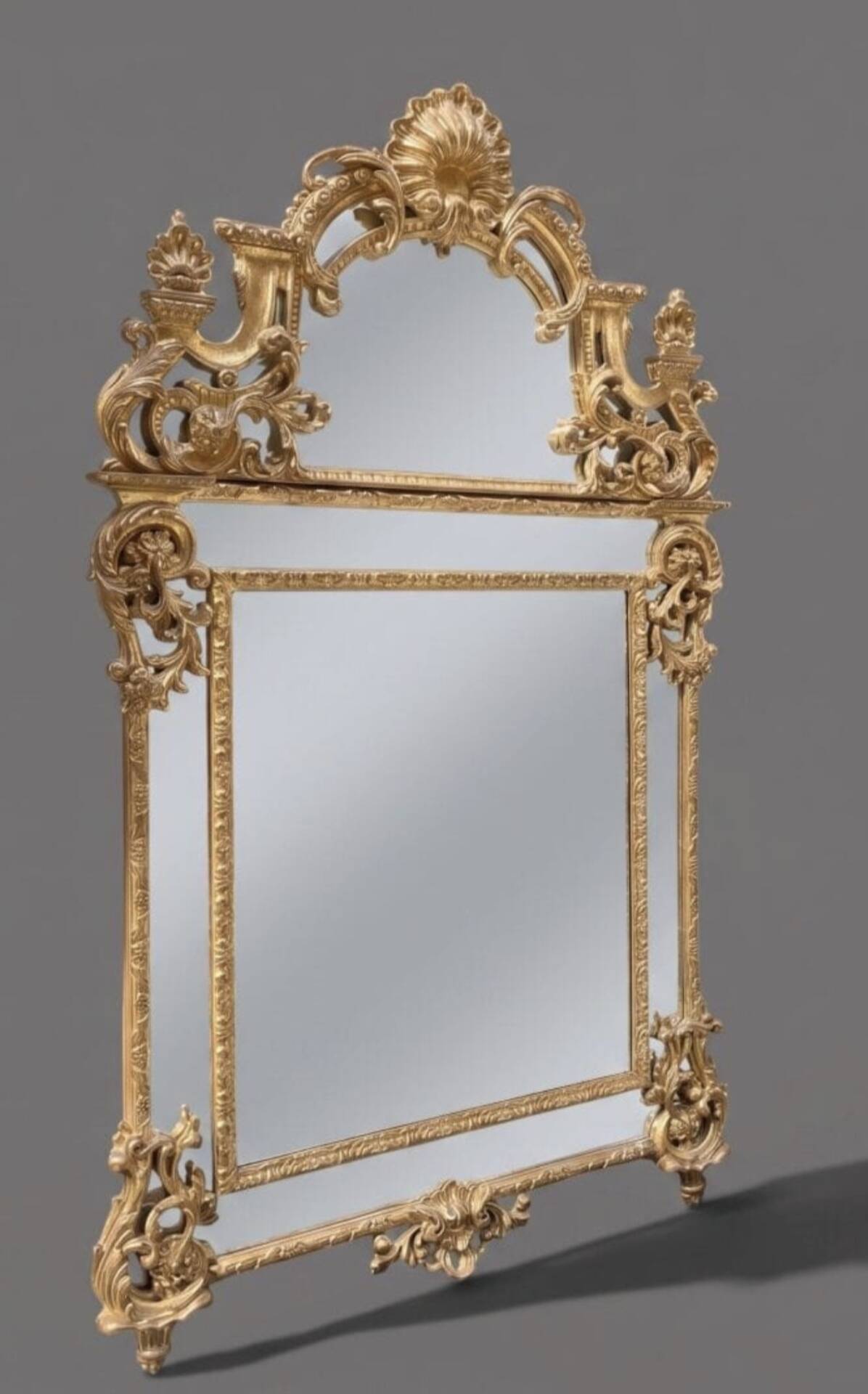 Regency style mirror in gilded wood, first half of the 19th century.