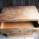 Old wooden chest of drawers with 4 drawers on wheels