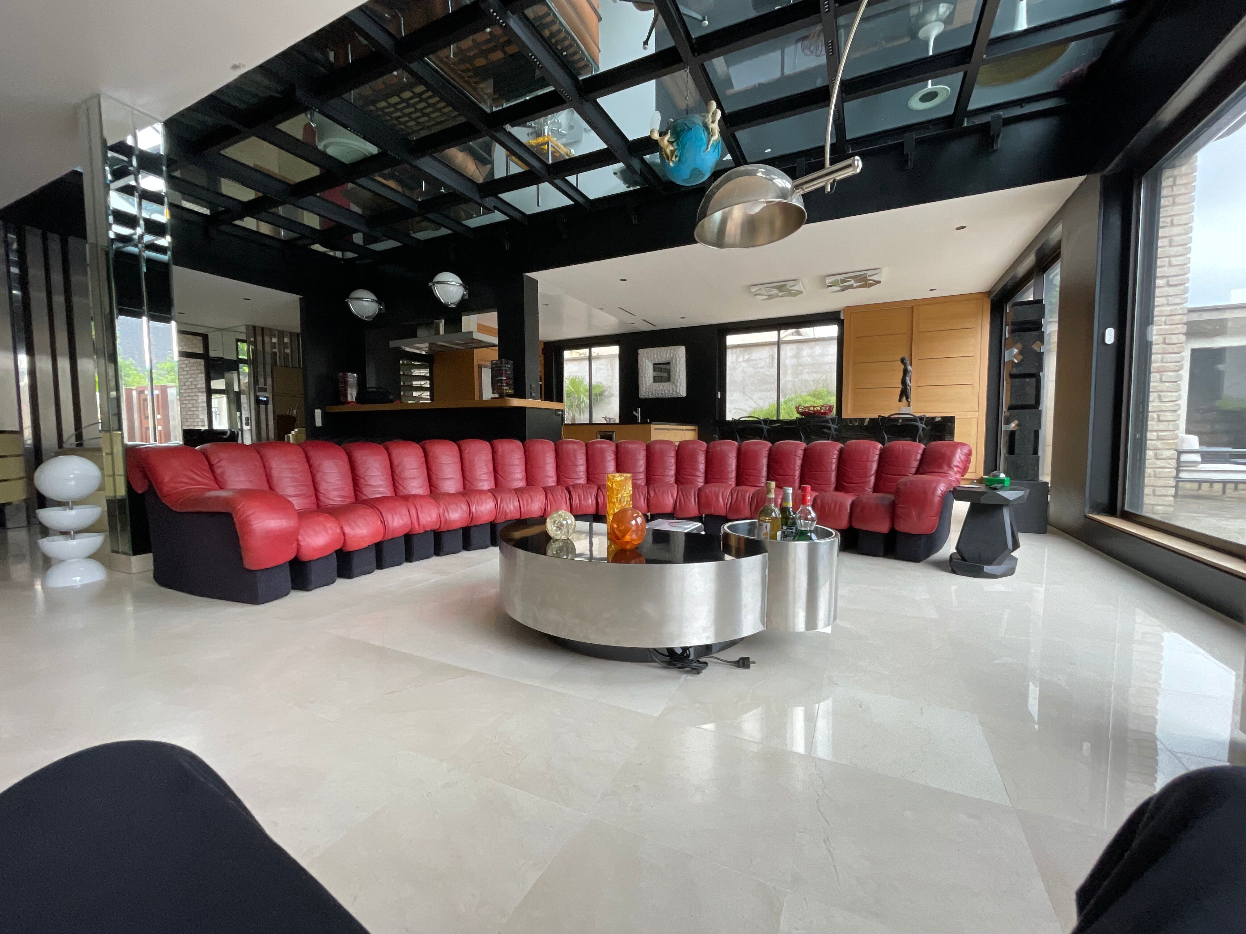 DS 600 model sofa or snake in dark red leather.