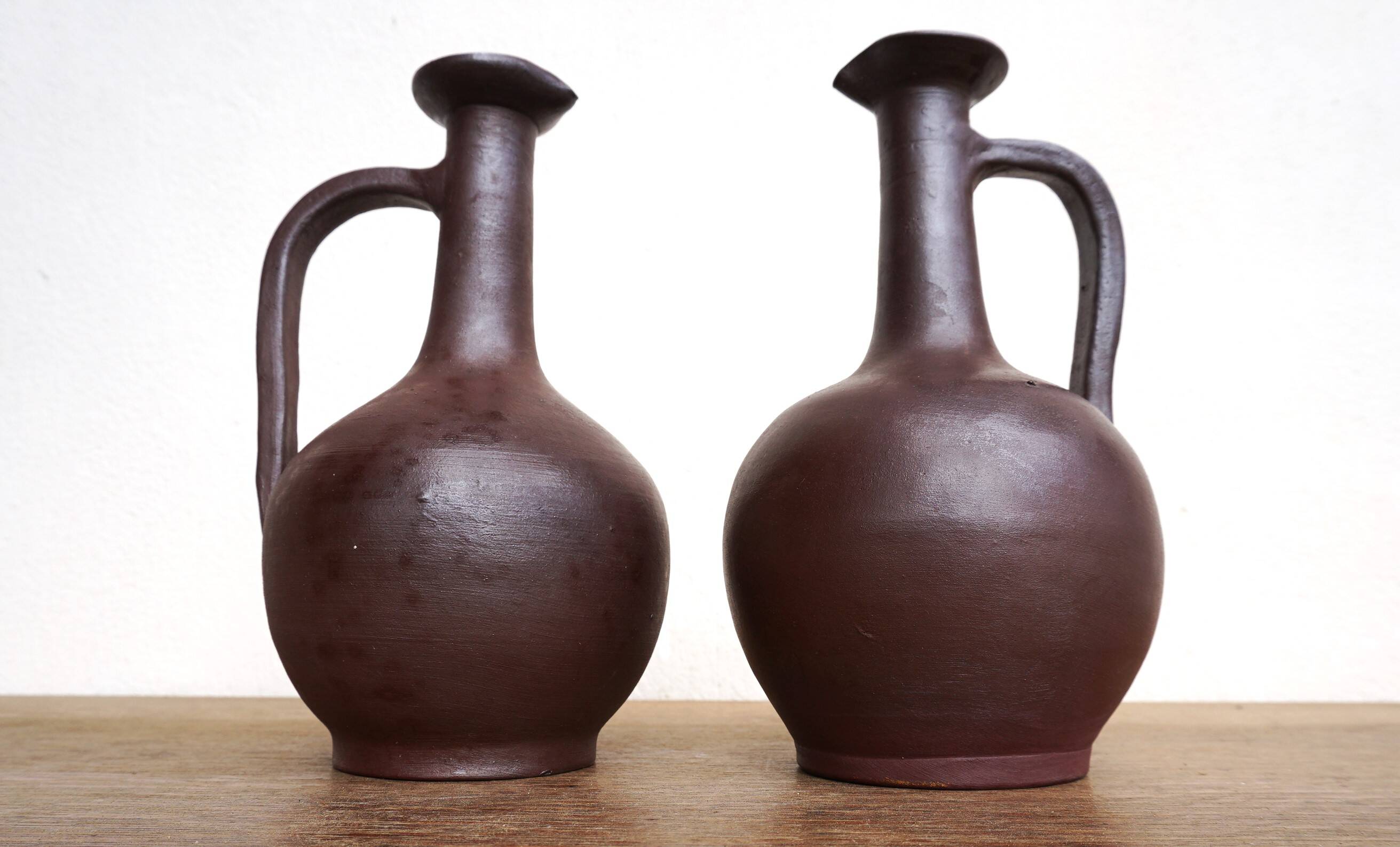 pair of terracotta bottles or carafes