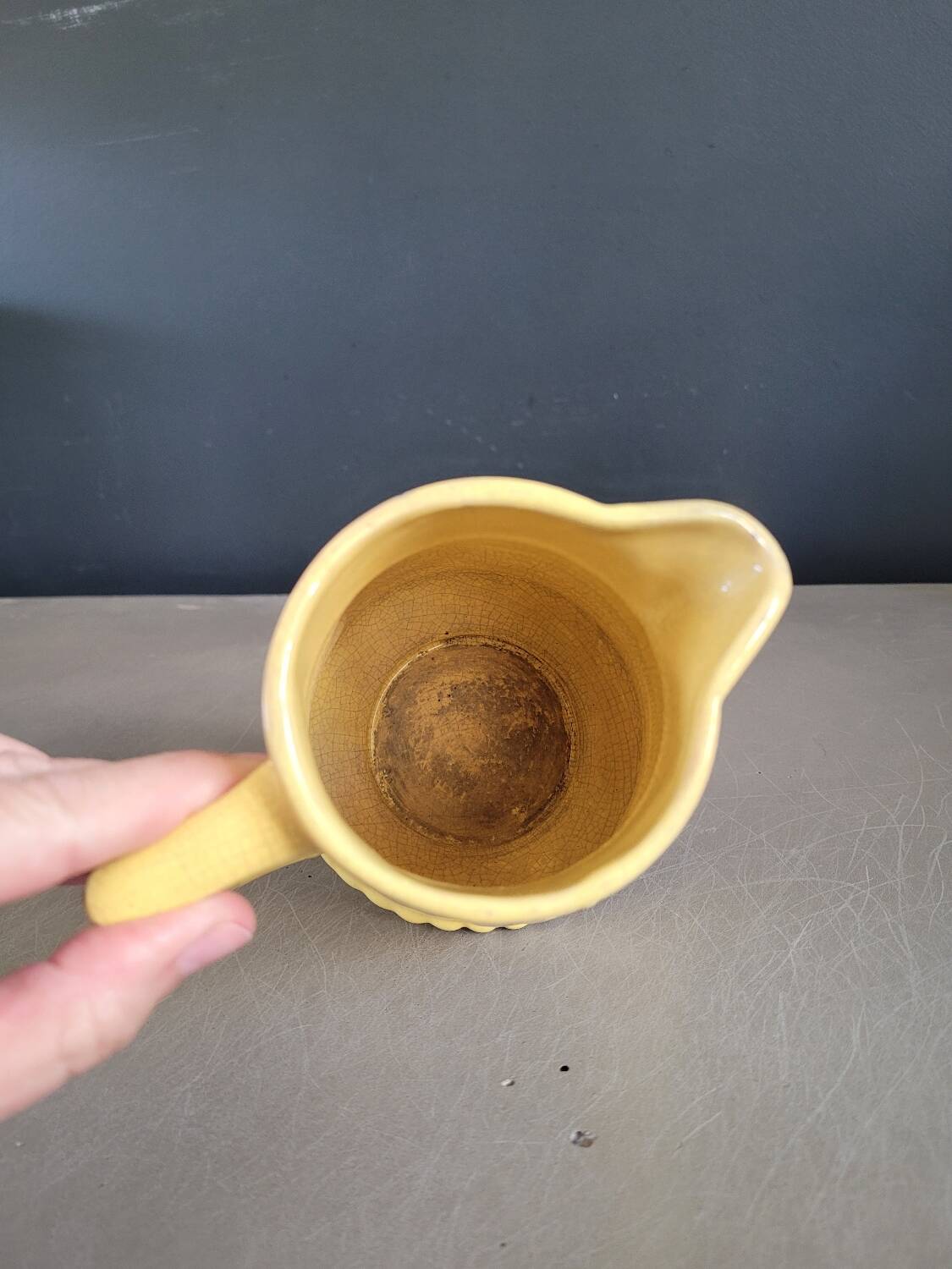 Yellow milk jug with reliefs