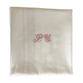Ancient damask tablecloth with monogram