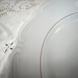 Hollow round plate in porcelain, double gold rim manufacture.