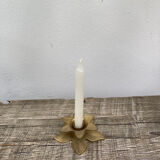 Old golden brass candle holder in the shape of a leaf or flower