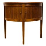 Old mahogany half-moon table with side shutters.