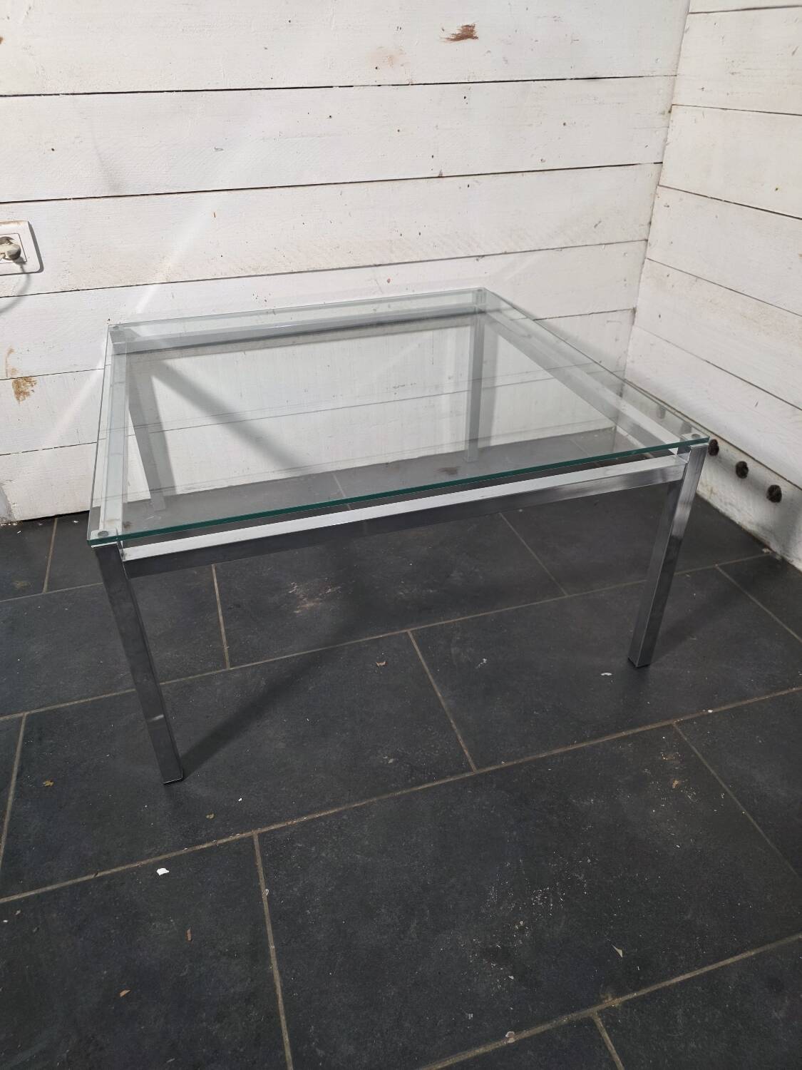 Chrome metal coffee table with a glass top from the 1970s.