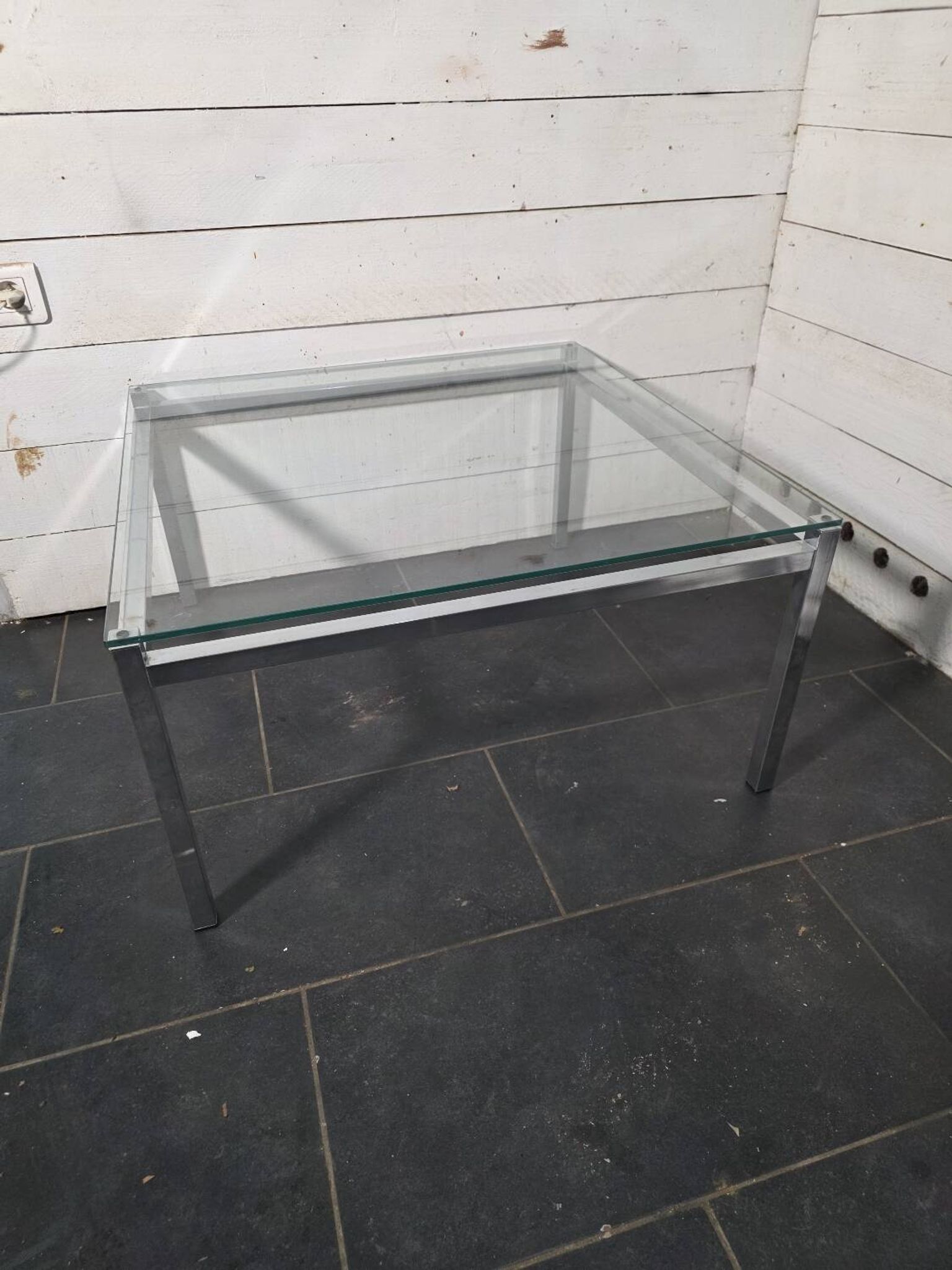 Chrome metal coffee table with a glass top from the 1970s.