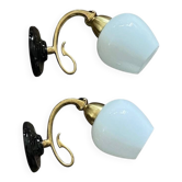 Pair of brass swan neck wall lights in Art Nouveau style with white globe tulips.