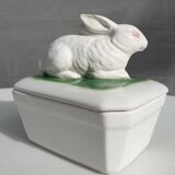 Pot terrine rabbit of Bavent in white earthenware on square of greenery