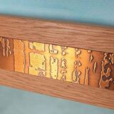 Vintage Danish wall mirror design from the 1960s in oak and stamped brass.