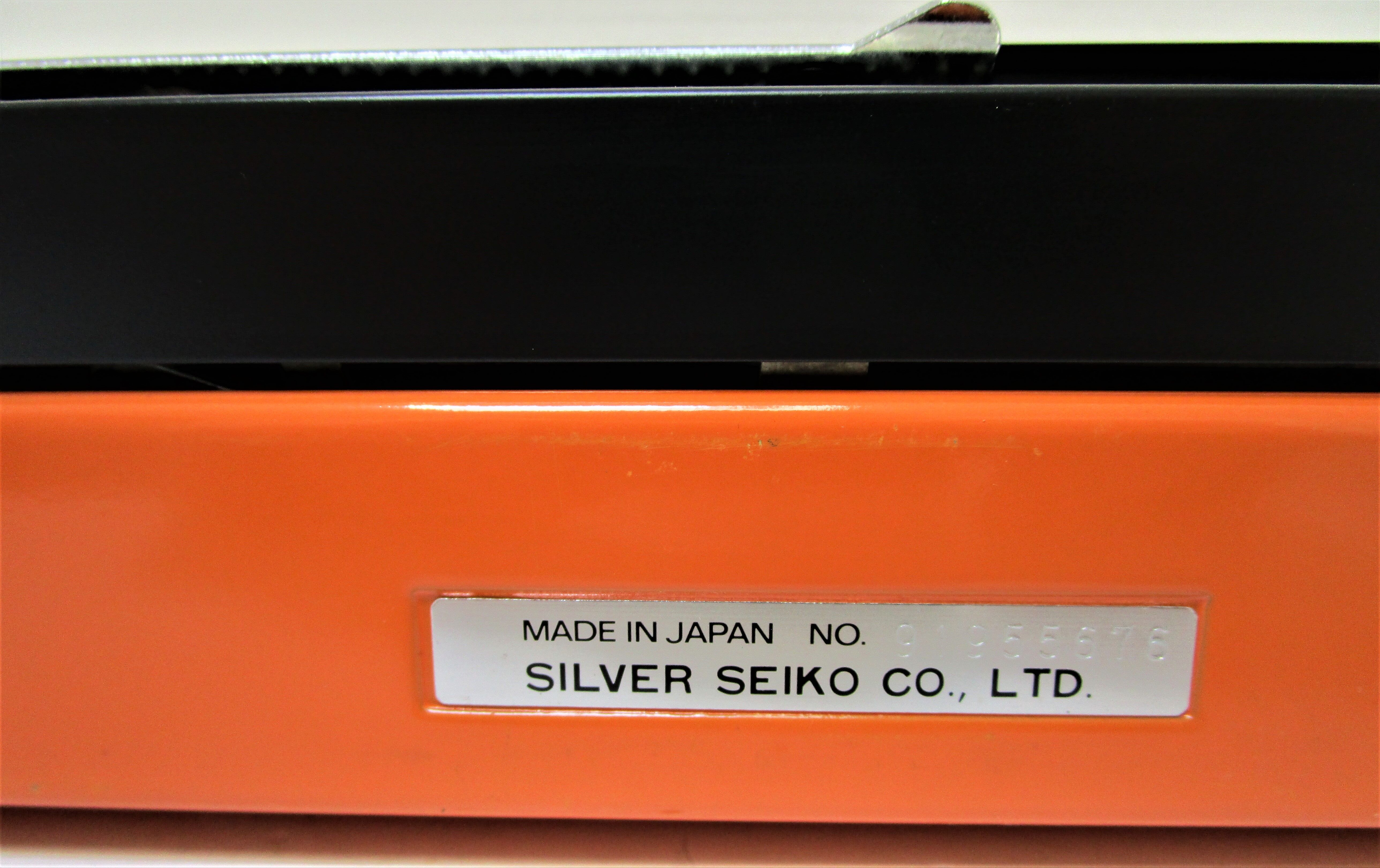 Silver Reed 200 orange metal typewriter made in Japan 70s