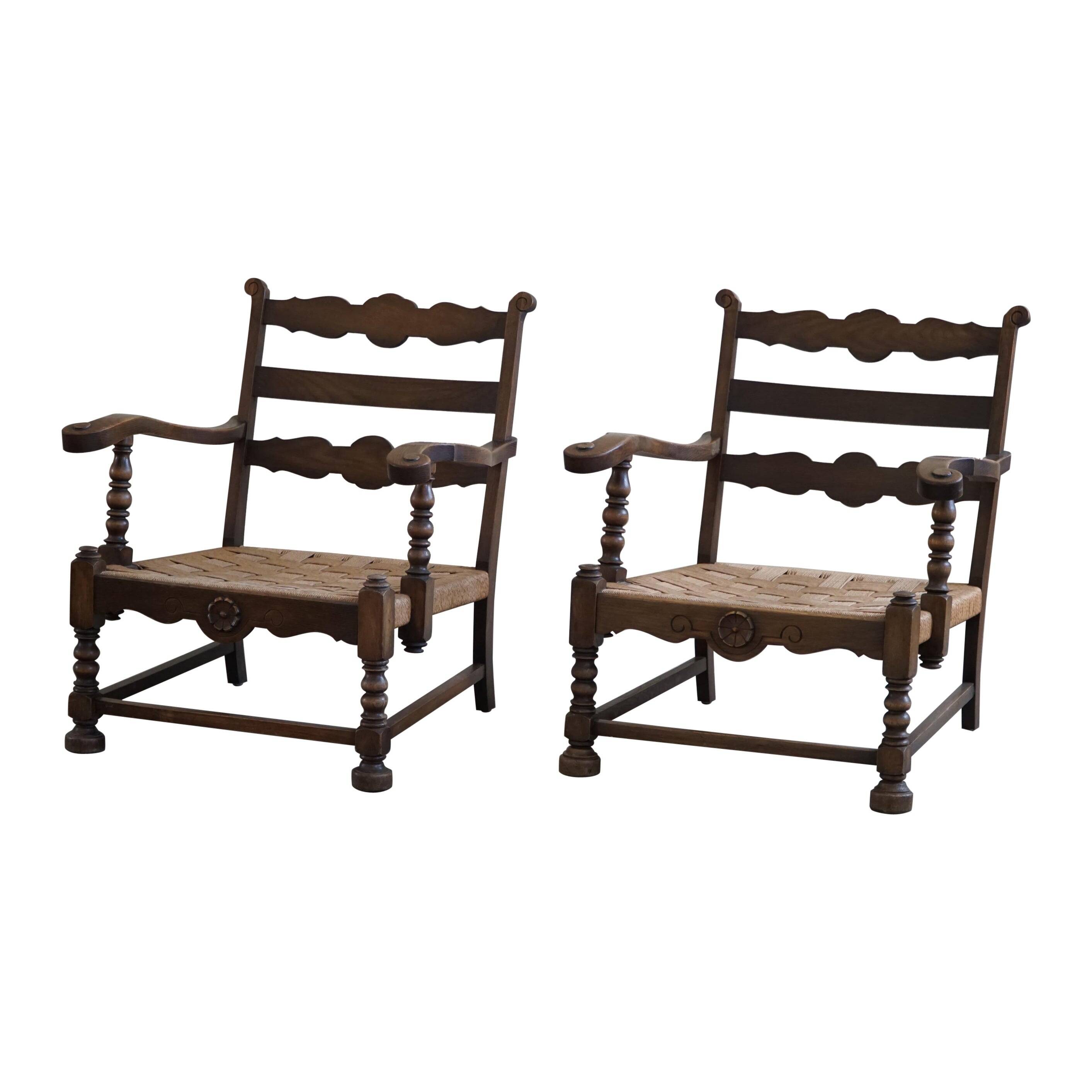 A pair of modern and sculptural vintage Danish armchairs in oak and papercord, 1940s.