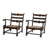 A pair of modern and sculptural vintage Danish armchairs in oak and papercord, 1940s.