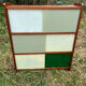Vintage 1960s display shelf with sliding glass doors.