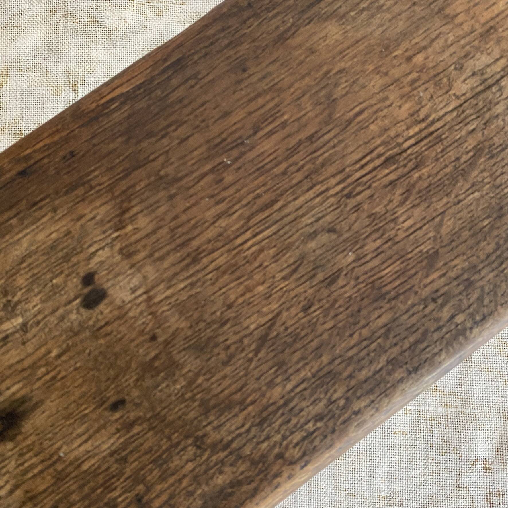 Old low stool made of solid wood