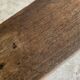 Old low stool made of solid wood