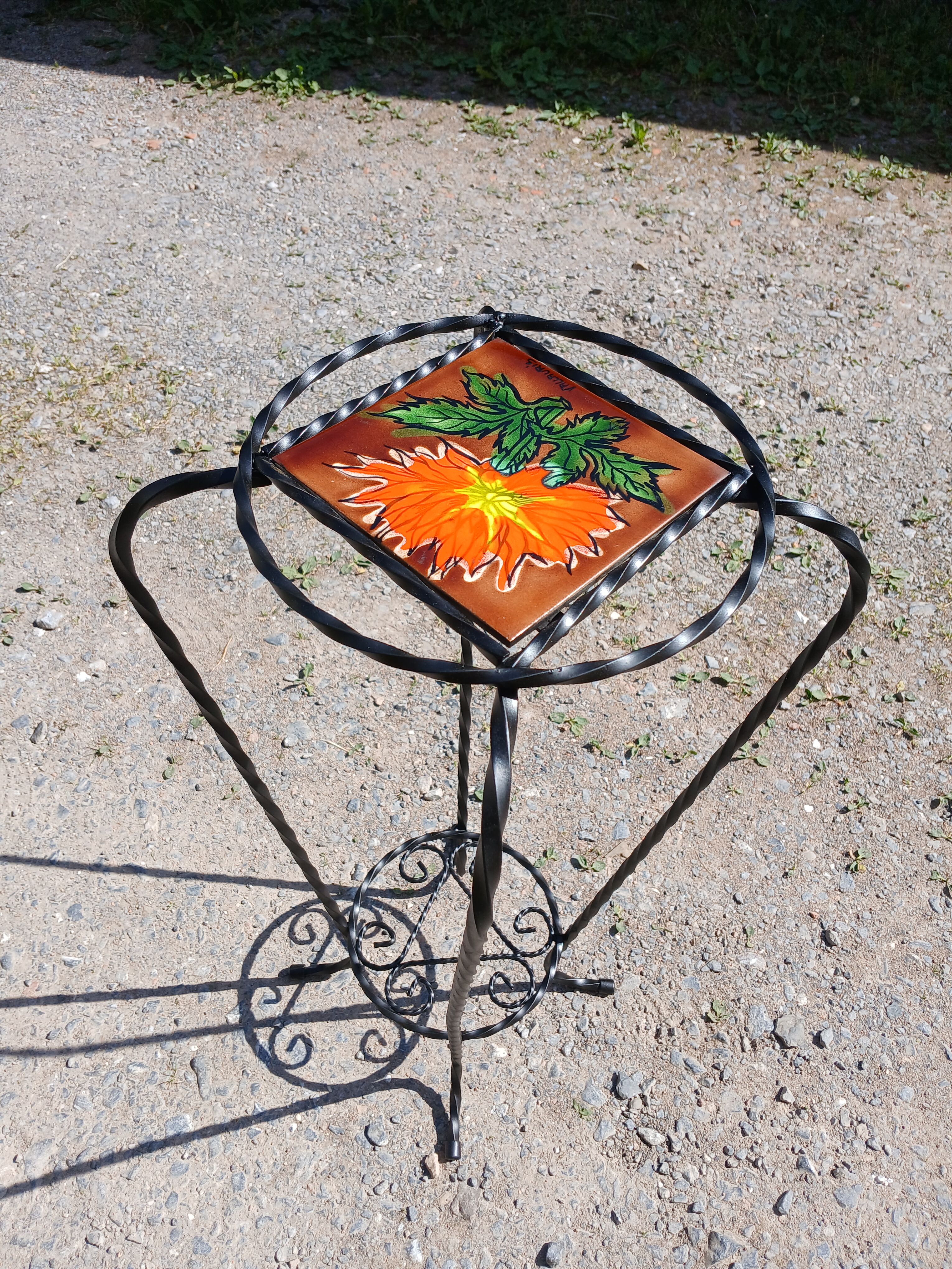 Vintage plant stand with Vallauris pottery.
