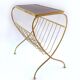 Brass magazine rack with shelf