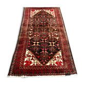 Ancient Persian carpet in hand-knotted wool