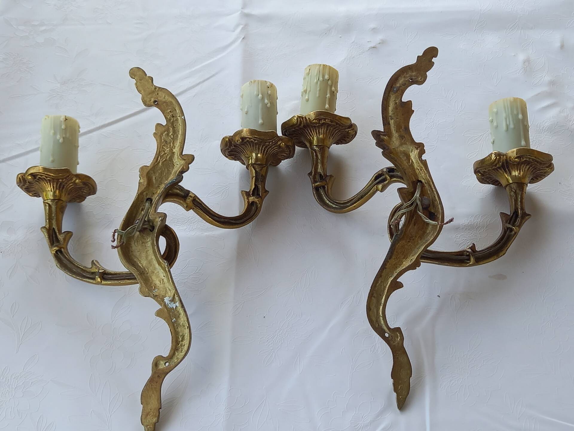 Old pairs of bronze wall sconces