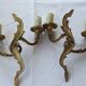 Old pairs of bronze wall sconces