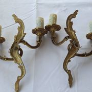 Old pairs of bronze wall sconces