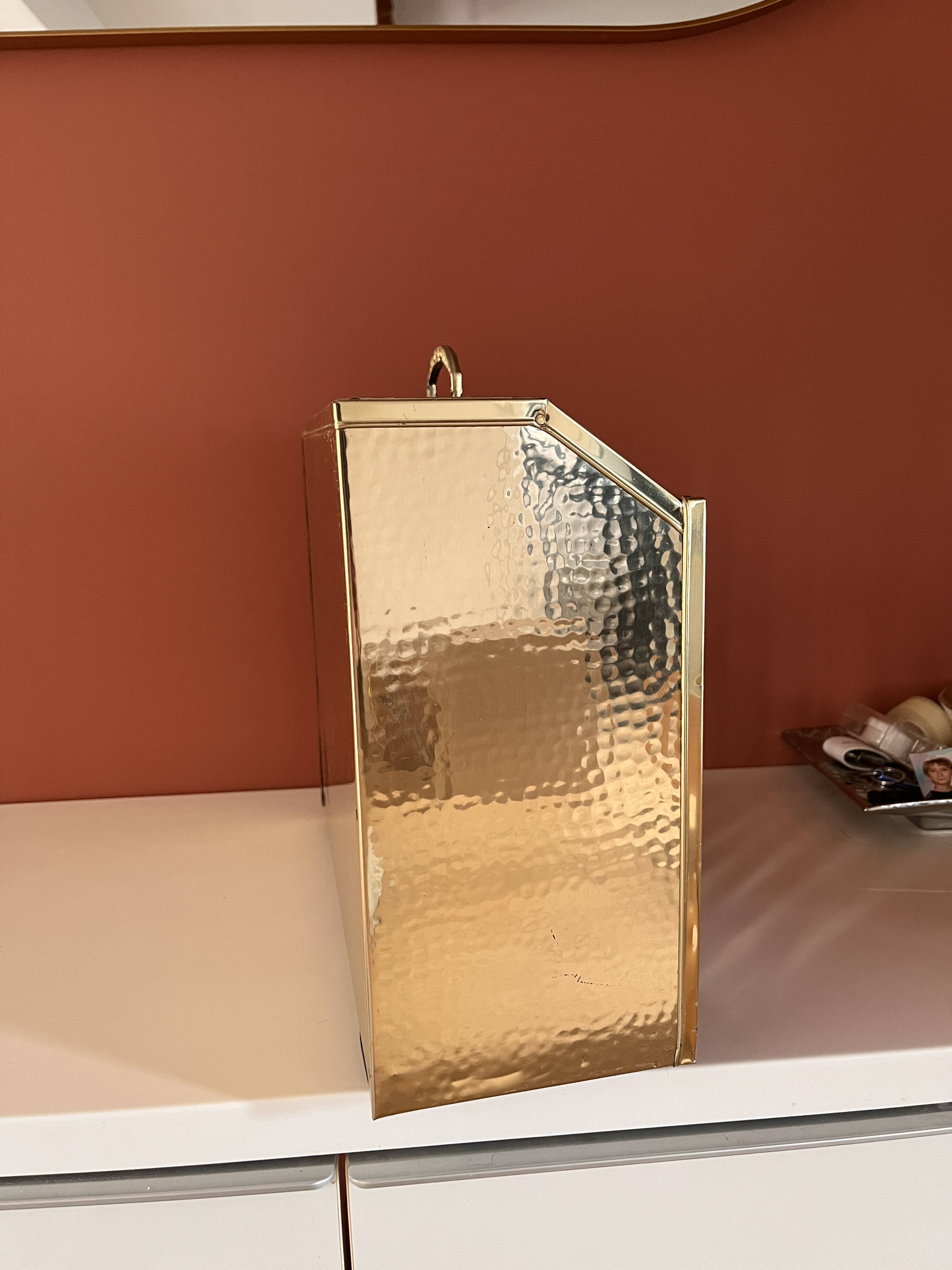 Brass and wood magazine rack in Hollywood Regency style.