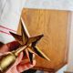Duo of brass star candlesticks