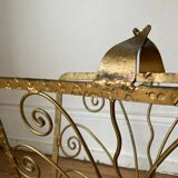 Vintage wrought iron magazine rack with gold butterfly design