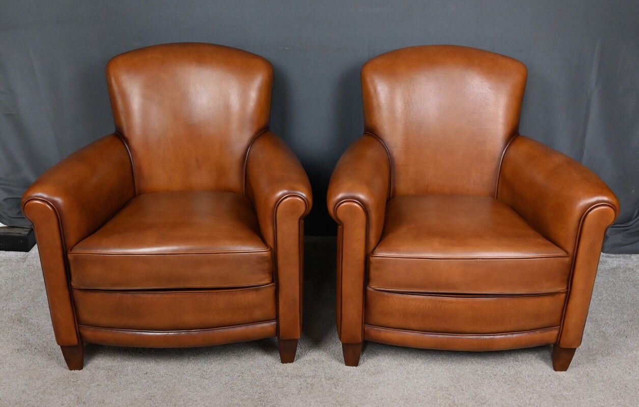 Paire de fauteuils club en cuir
