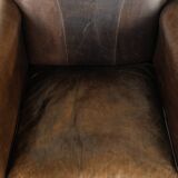 Characterful sheepskin design armchair with beautiful patina