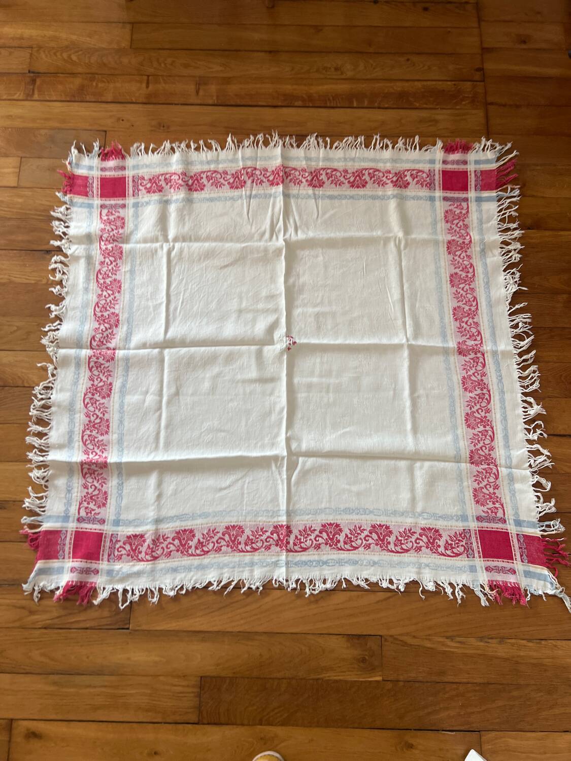 Old cotton tablecloth with flowers and fringes