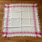 Old cotton tablecloth with flowers and fringes