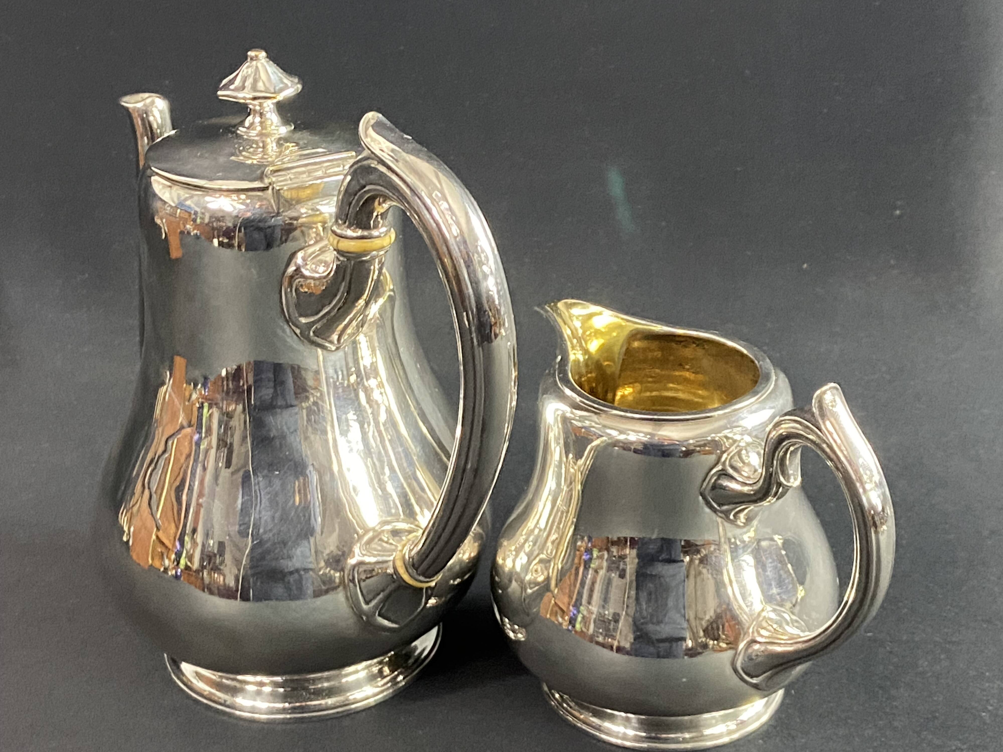 Silver-plated coffee pot and milk jug monogrammed MA, signed CHRISTOFLE.