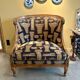 Armchair in a wooden confessional style with black and beige cotton.