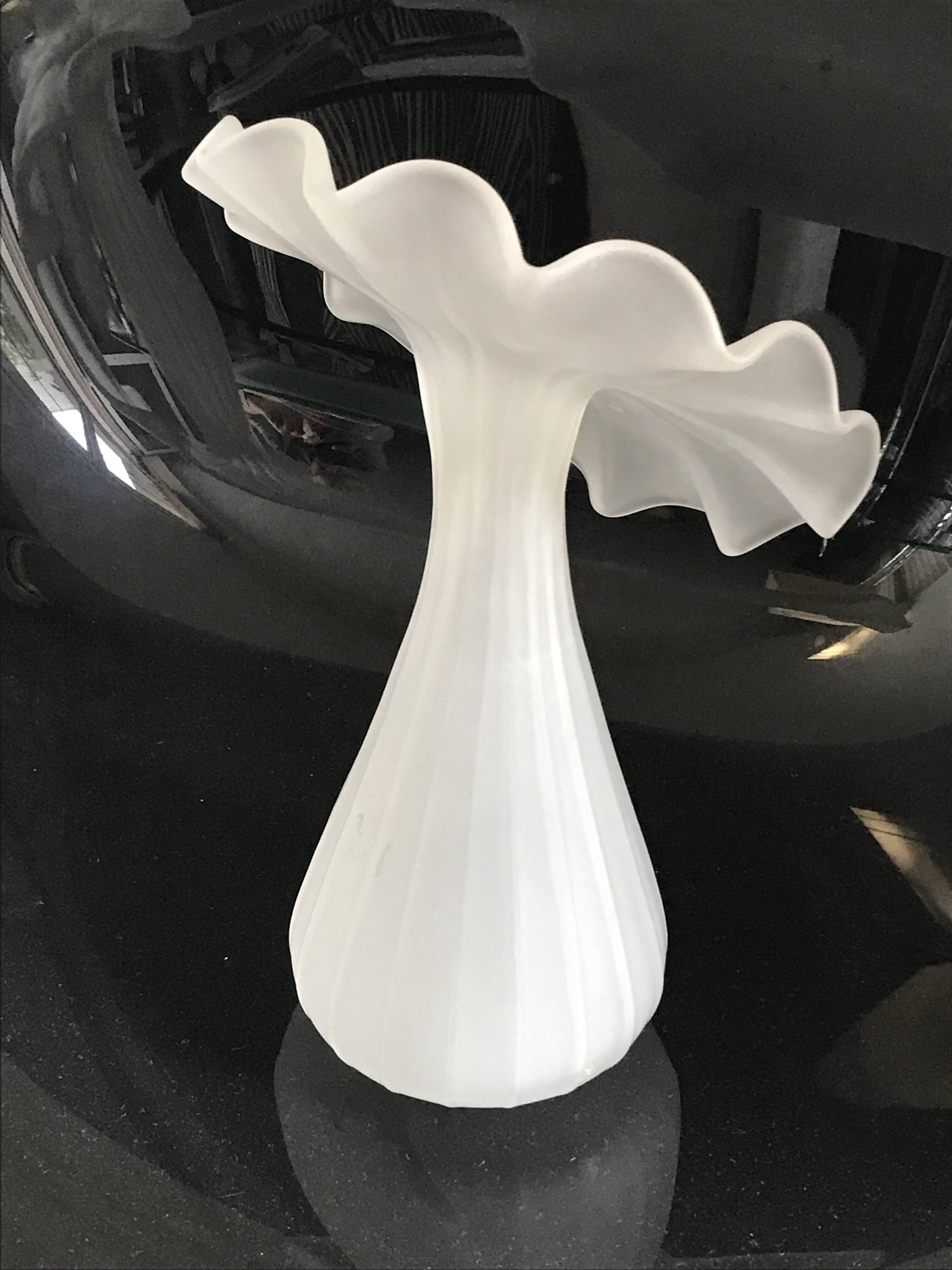 Vintage satin white glass vase with a wavy corolla