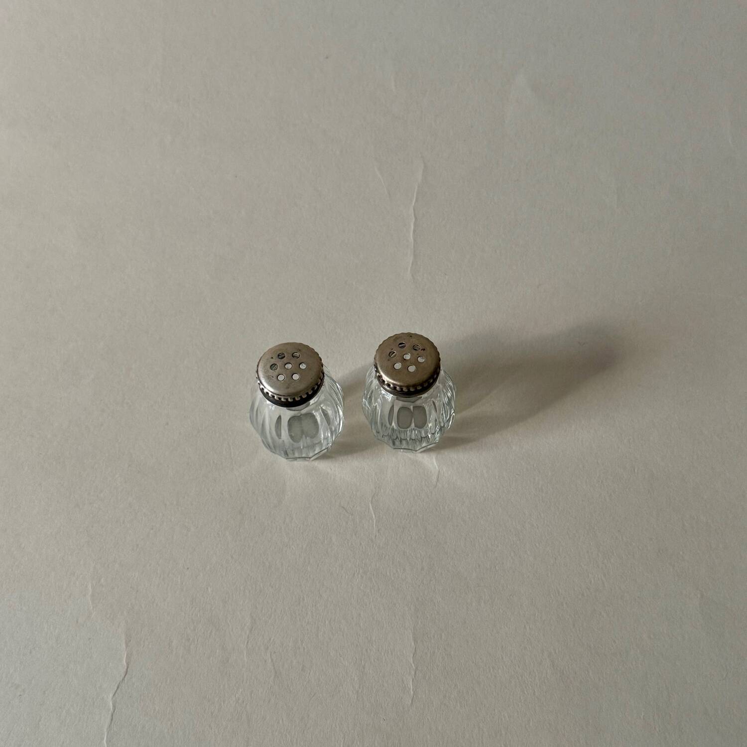 Pair of vintage Christofle glass and silver pearl salt cellars