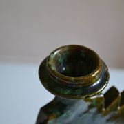 Green ceramic sun candlestick from Tamegroute, Morocco.