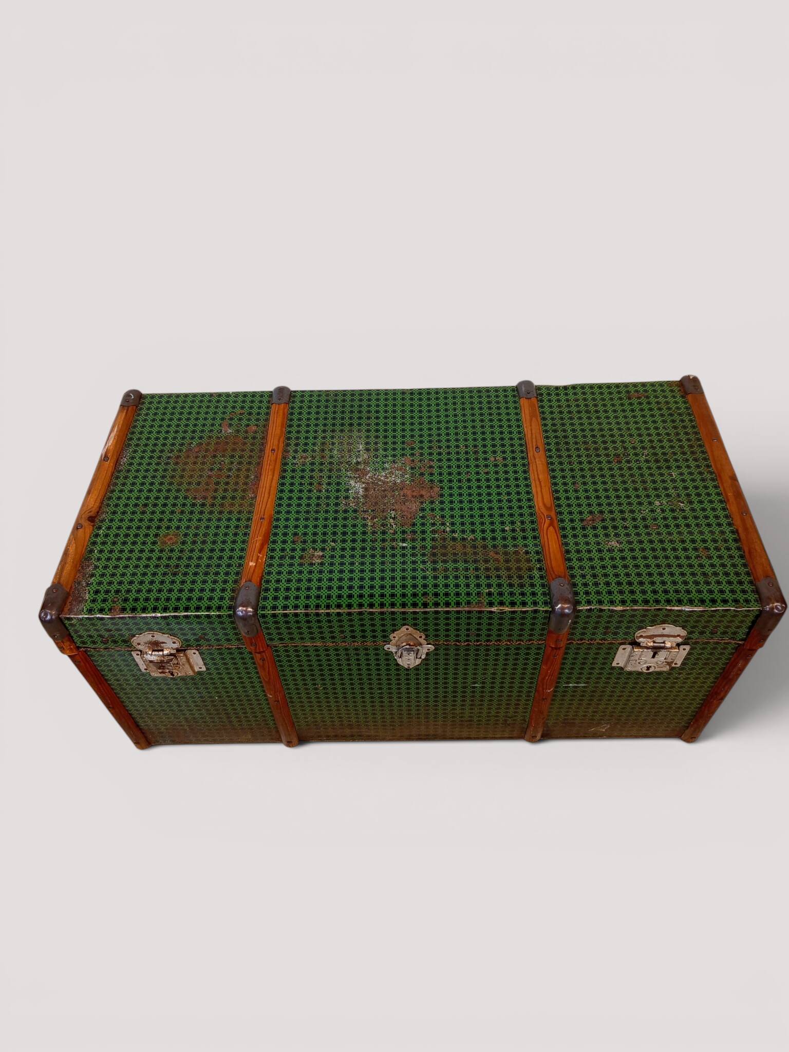 Vintage wooden and metal green travel trunk, circa 1930.